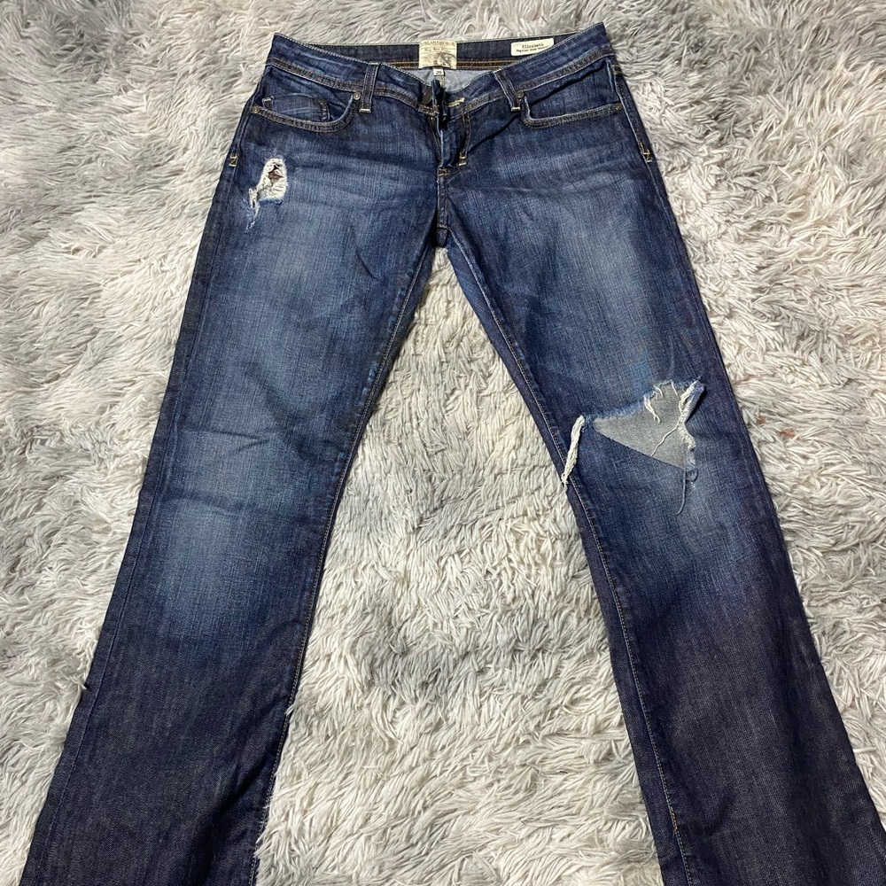 Blue Boot Cut Jeans with Distressed Details